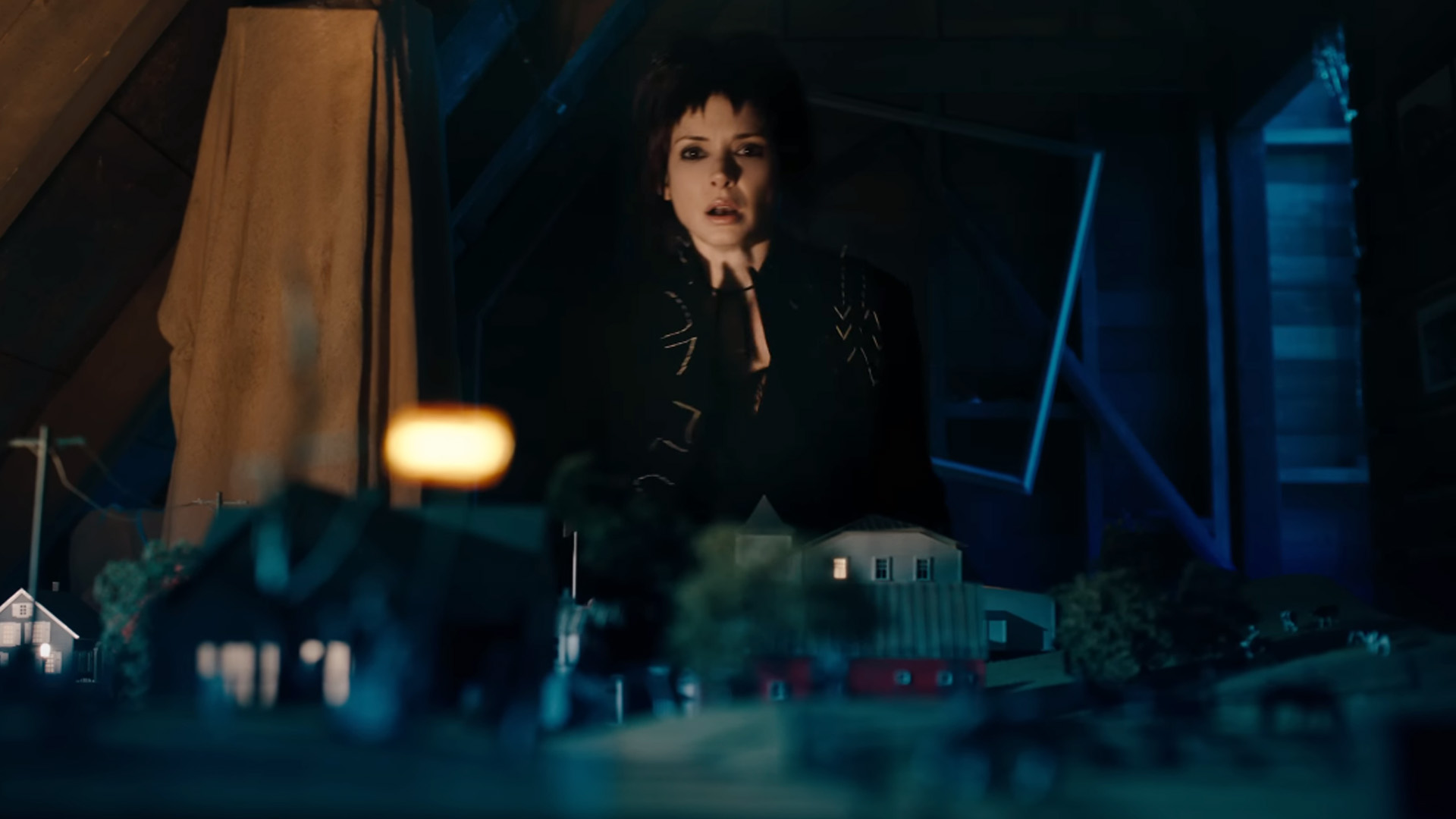 Winona Ryder reprises her role as Lydia Deetz. And it seems she still has her goth fashion sense as she rediscovers the miniature town that houses Beetlejuice (Michael Keaton).